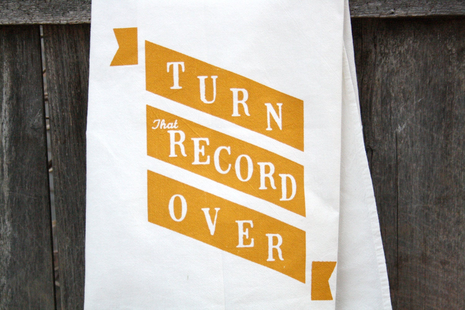 Kitchen Towel "Turn That Record Over" banner print in mustard yellow ink on white towel