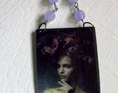 Very fashion forward piece with lilac beads and lovely fashionista with flowers in her hair
