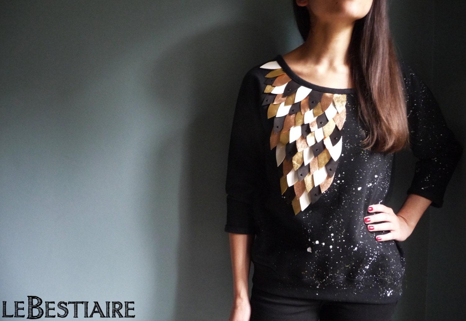 Black flecked cotton sweat shirt embroidered with leather feathers