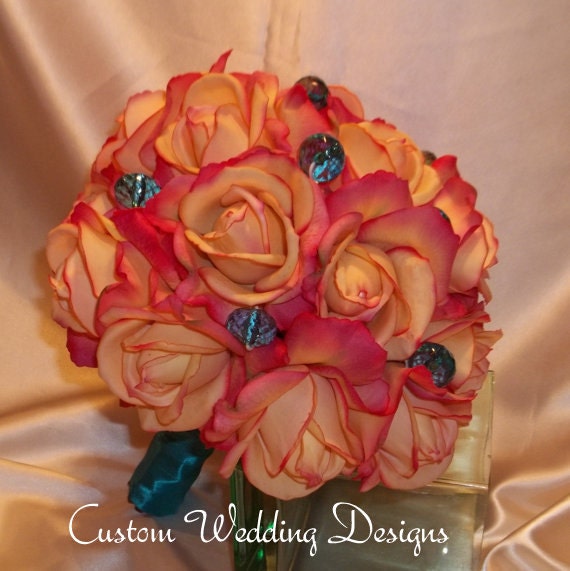 Shades of Coral Real Touch Roses Wedding Bouquet with Either Large or Smaller Teal Crystal Accents and Satin Hand Tied Stems.