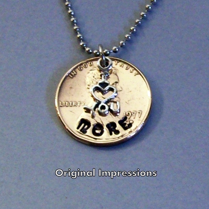 I love you more - penny coin jewelry pendant necklace made of a genuine U.S. coin with a sterling silver charm on a stainless steel chain.