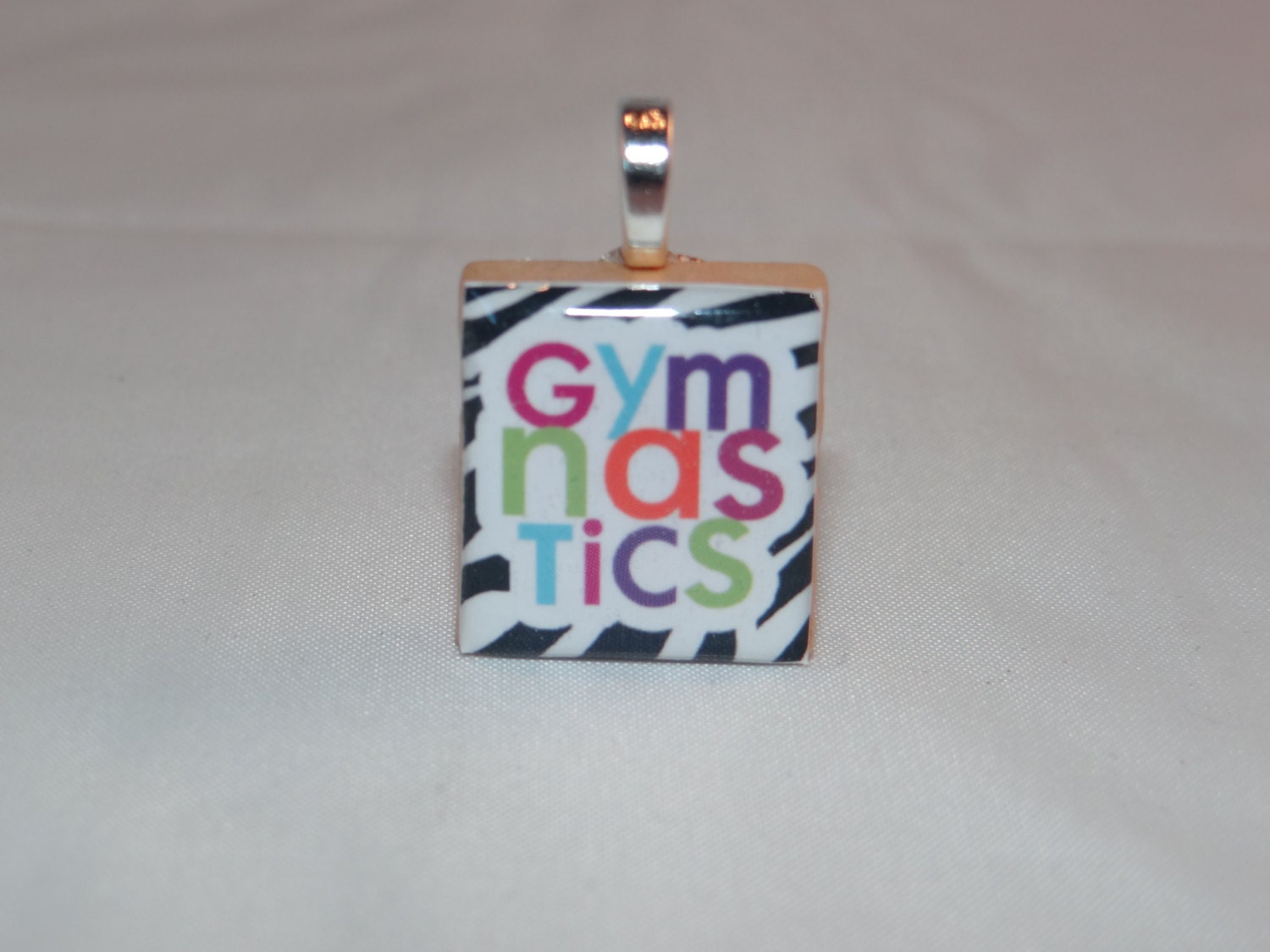 Gymnastics zebra print pendant