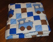 Appliqued Choo Choo Train Baby Quilt,  Nine Patch Patchwork in Cocoa Brown, Blues and Cream highlights the Blue Appliqued Choo Choo Trains