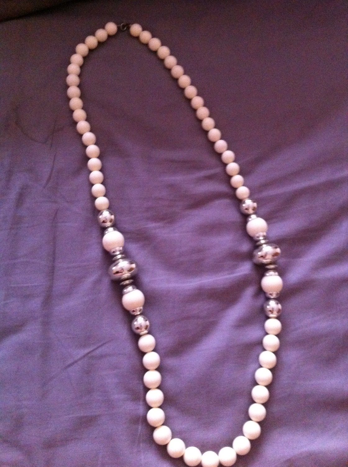 Off white ball necklace with metal accents