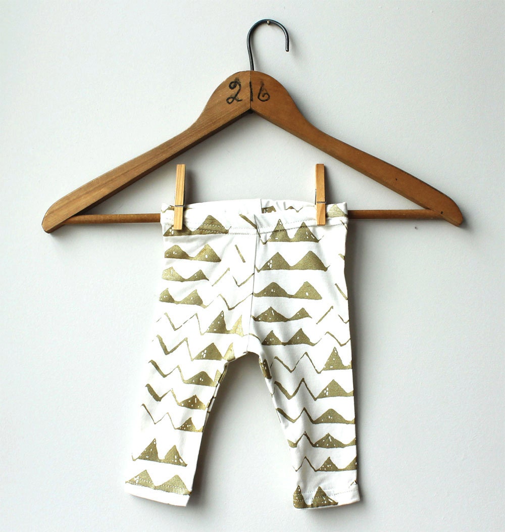 Hand Printed Organic 'Mountain' Baby Leggings in Gold on Creme