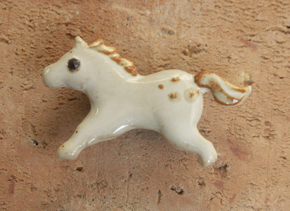 Horse magnet,  white and rust stoneware