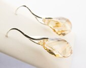 Crystal Earrings: SWAROVSKI ELEMENTS Dangle Earrings Of Champagne Colour