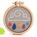 Rain cloud embroidered brooch - red, navy, orange, purple and green raindrops - made with love by dandelyne