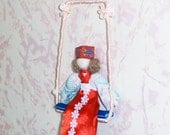 Needle Felted Girl in Russian National Clothes Sitting on Swing