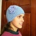 Handmade crocheted cloche hat with hand crocheted flower
