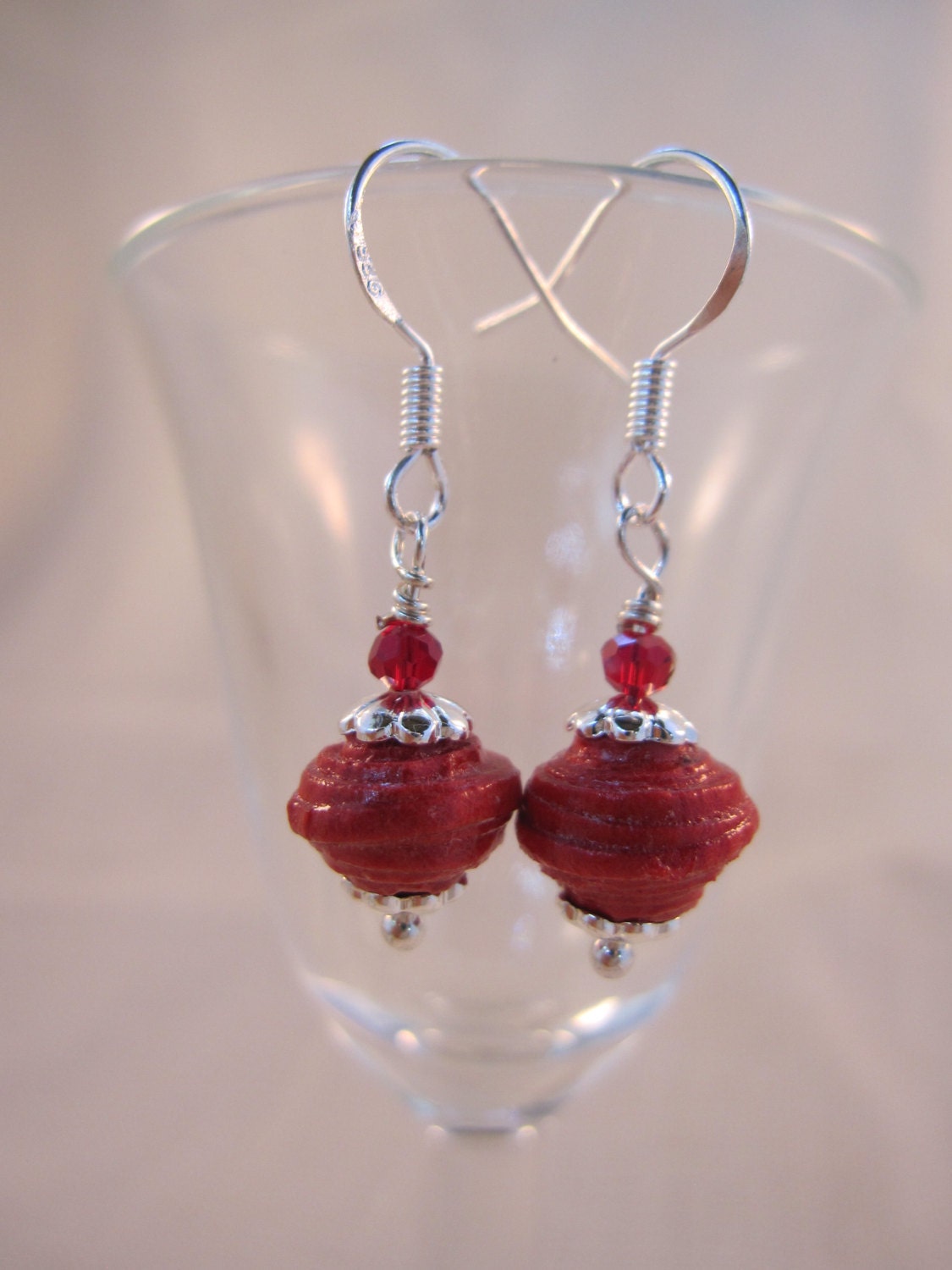 Paper corral earrings made with beads crafted from Italian handmade paper