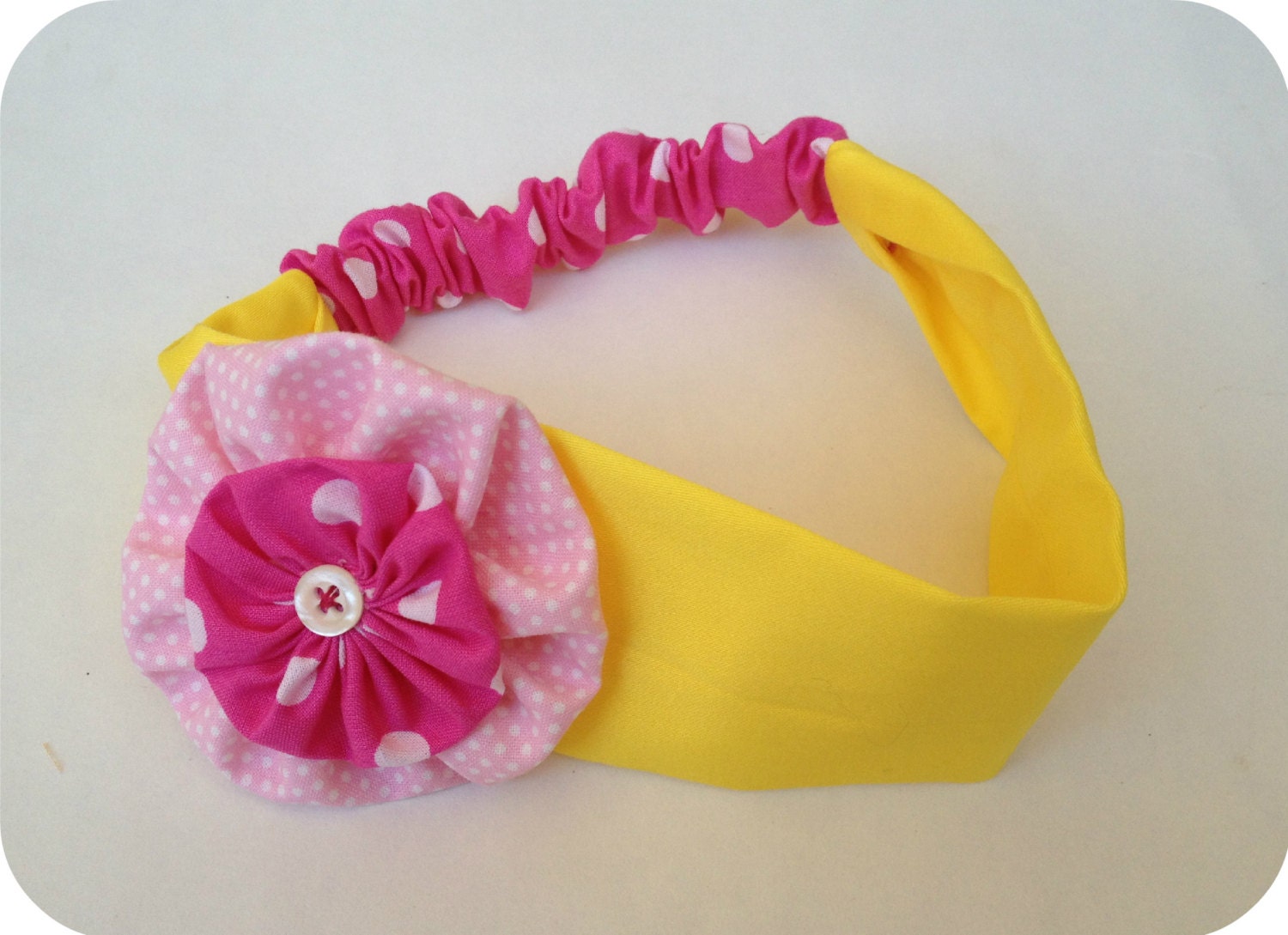 Handmade cotton yellow and fucshia headband with coordinated yo-yo fabric flower. Spring celebration gift, girly hair accessory