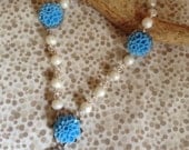 Pearl and Blue Chrysanthemum flower necklace with bird charm
