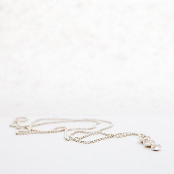 Silver necklace with three shells