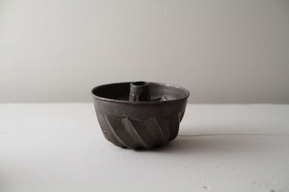 Antique small baking mold or form. Aged steel. Toy. Shabby chic. Rustic home and kitchen decor.