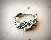 Bird Ring with Green Peridot and Hand Carved Braid in Cast Silver