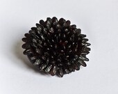 Tiny black brooch made with rice (one piece)