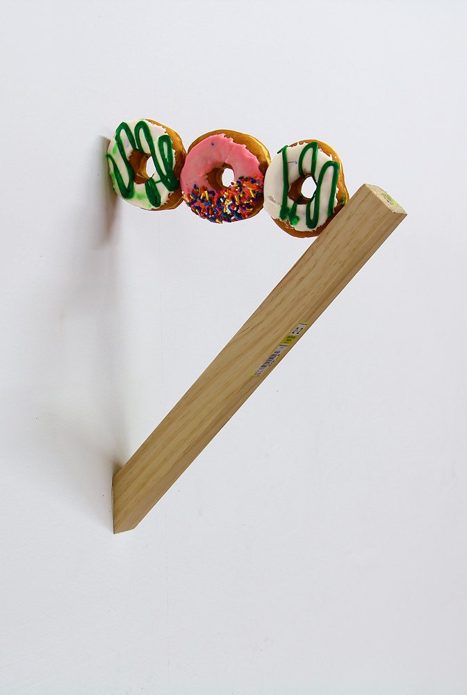 new york jets donuts balanced between Pink Sprinkle donut and wood plank (Support GAY MARRIAGE EQUALITY) Supreme Court funky zany
