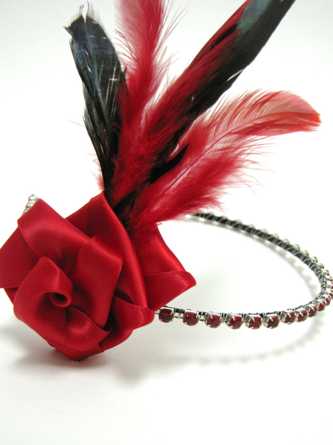 Red and black feather and satin rose with rhinestones headband.
