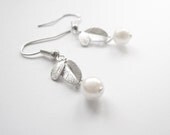 White pearl elegant earrings with silver leaves