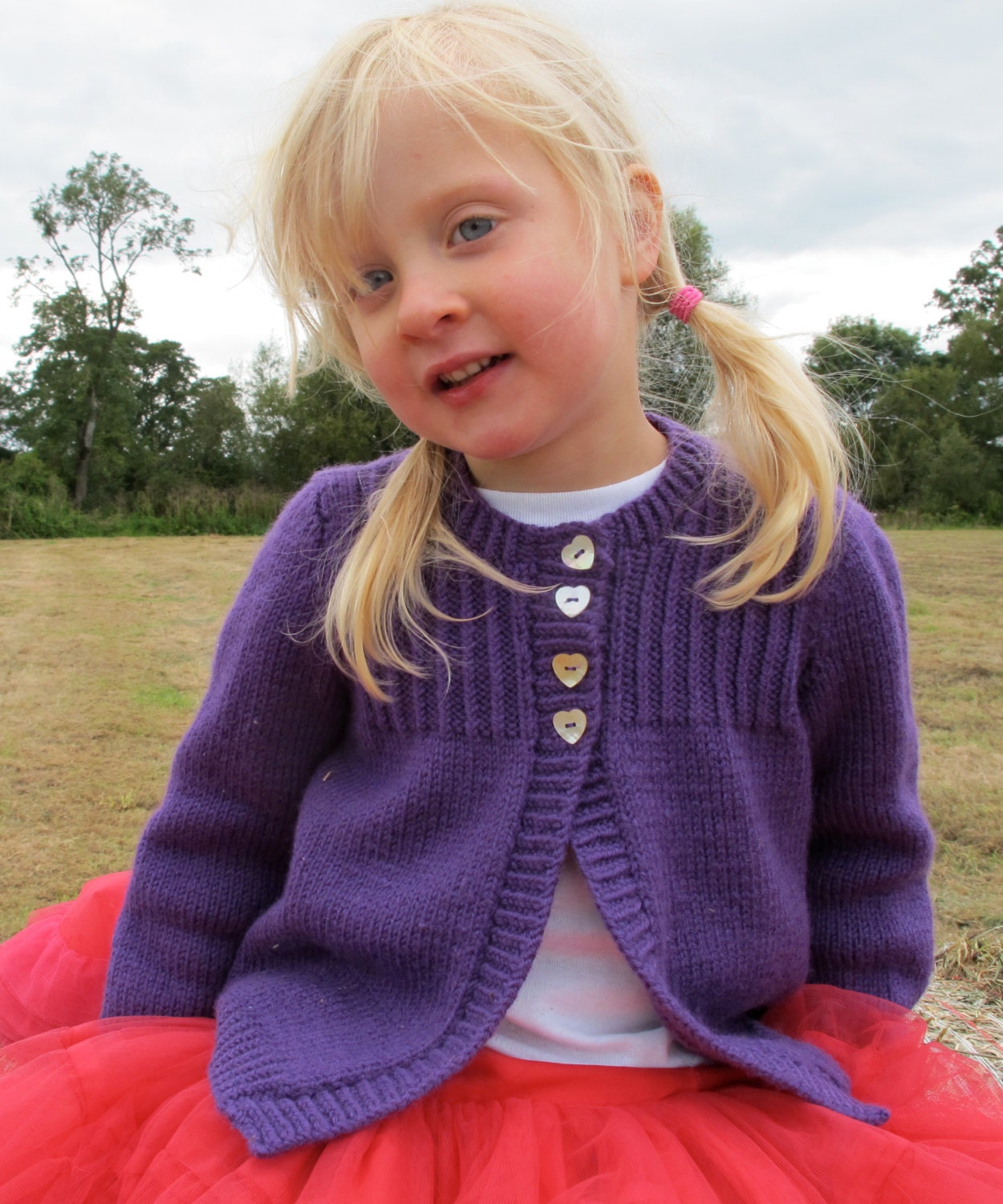 Handknitted purple cardigan with ribbed detail