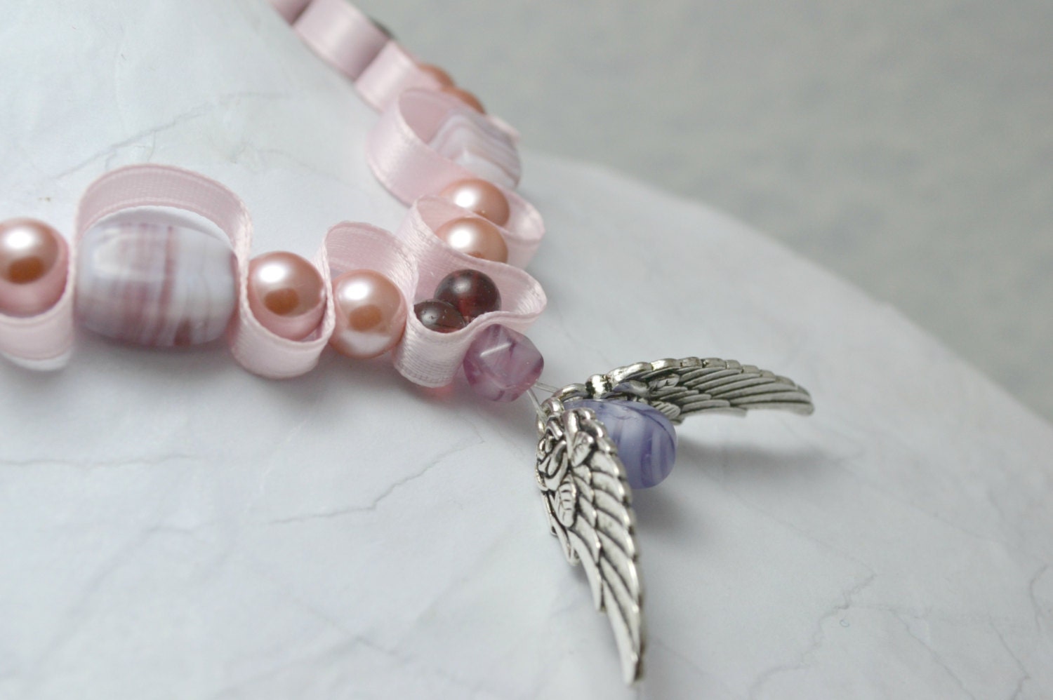 Angel wing bead and ribbon necklace. Tibetan silver wings. Pink and purple beaded ribbon jewelry. Ships free.