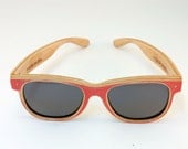 Deck Specks DSG416 are blood red and beaten all over.  Both face front and the arms are same-board.
