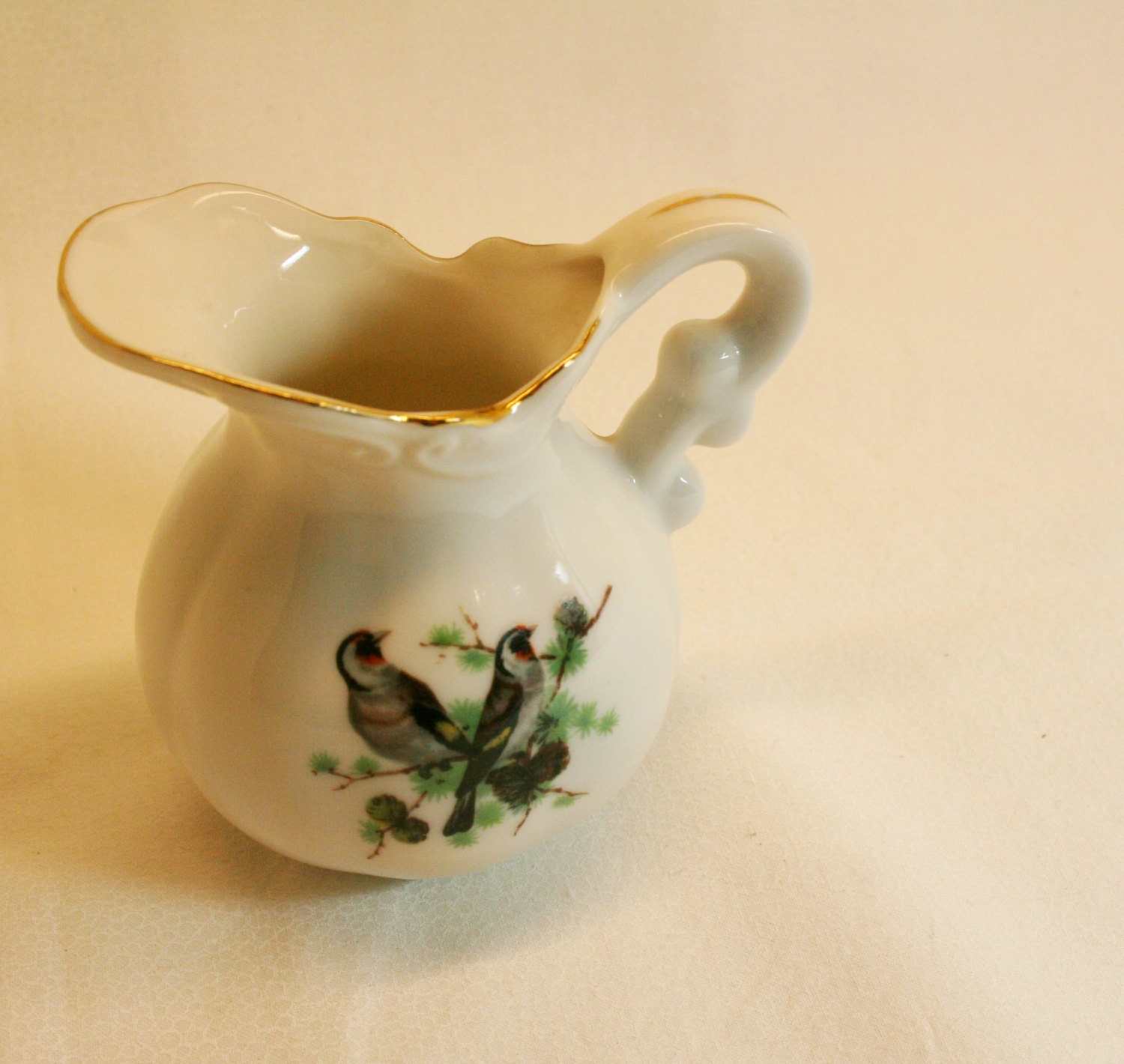 Very small porcelain pitcher-mockingbird pair-made in japan-creamy white- pitcher with gray birds