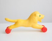 Vintage Russian Yellow Lion on wheels - TwoRedSuitcases