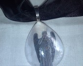 DOCTOR WHO Weeping Angel Glass pendant on satin