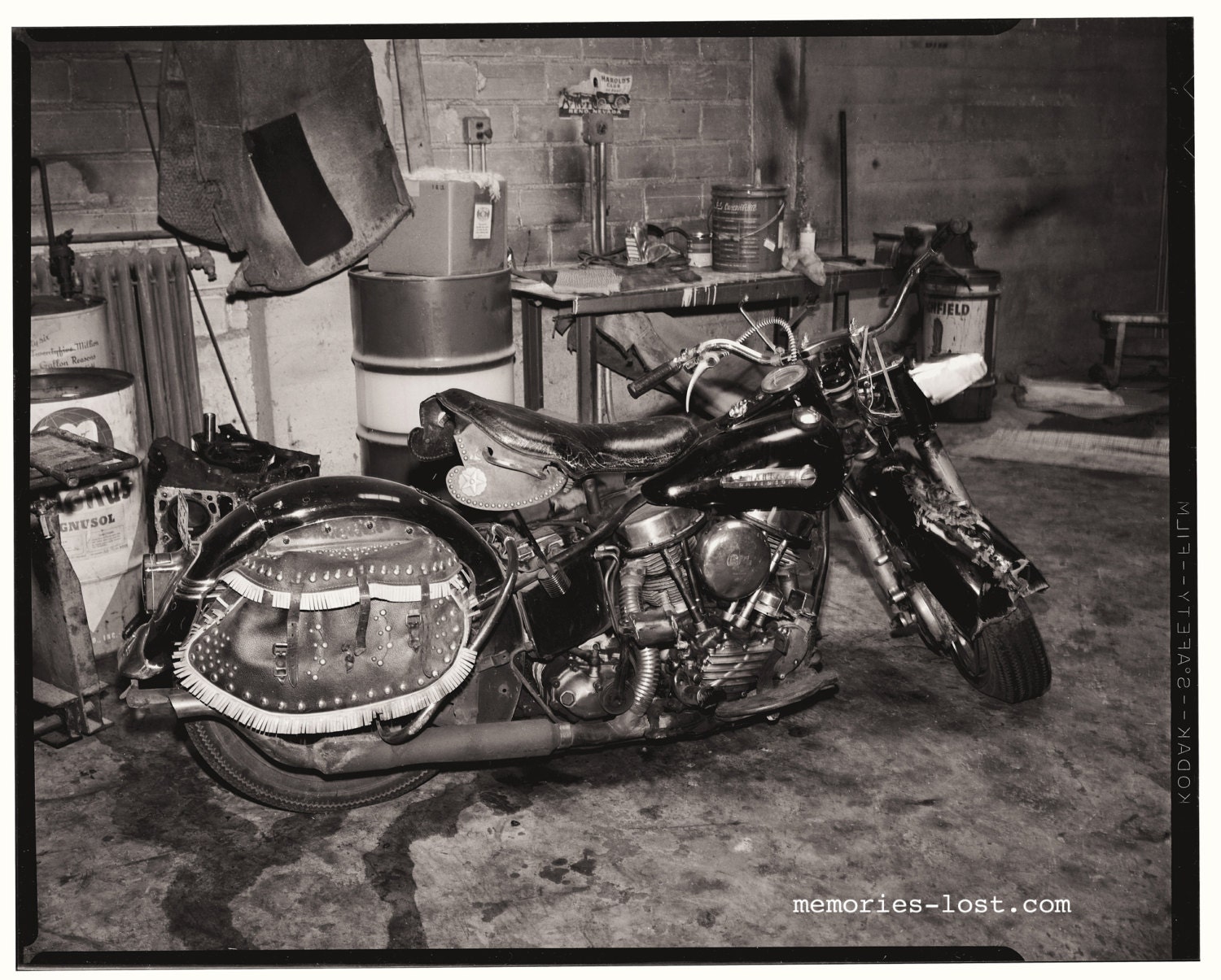 Old Harley crashed in garage, 1960s