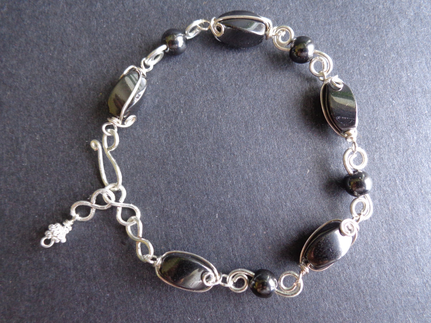 Magnetic hematite bracelet, wire wrapped, handmade by Iris Jewelry Creations.