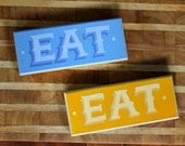 Hand Painted "EAT" Signs in Blue and Yellow
