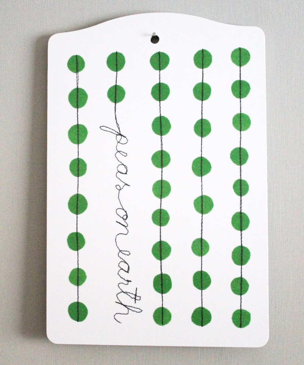 Cutting board peas on earth