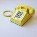 yellow push button phone