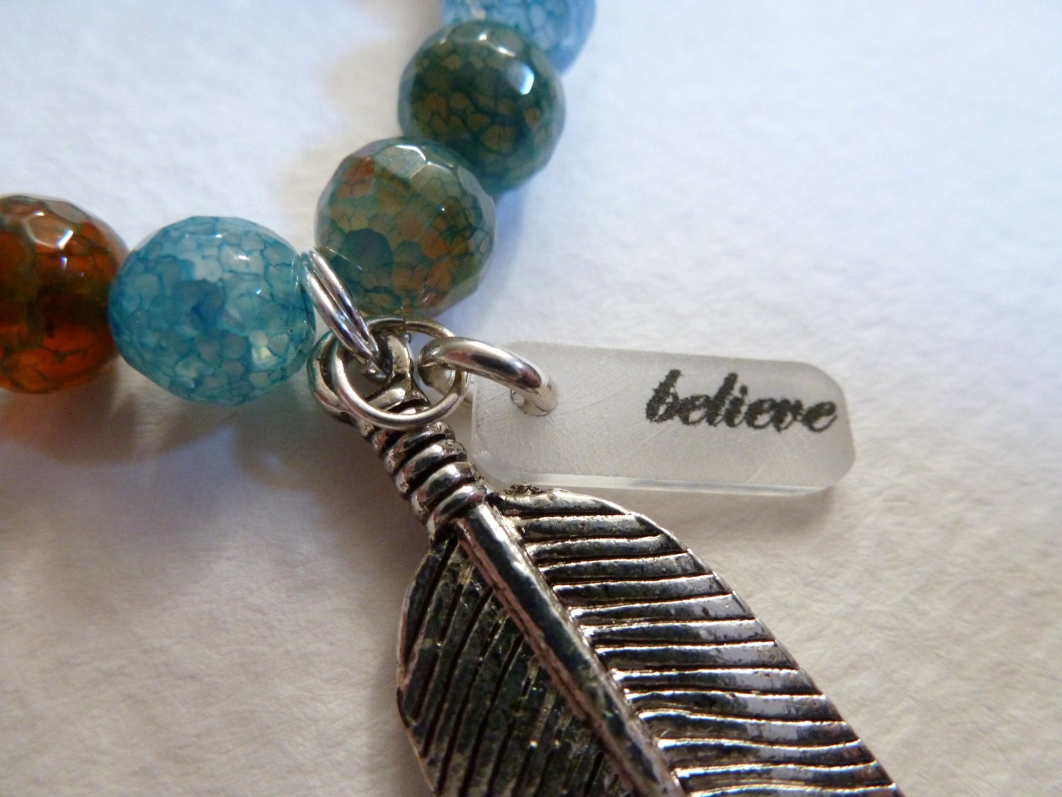 pisces  -  fired agate with charms