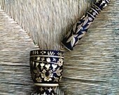 mortar and pestle, hand decorated with wood burning pens in a flower bird leaf design