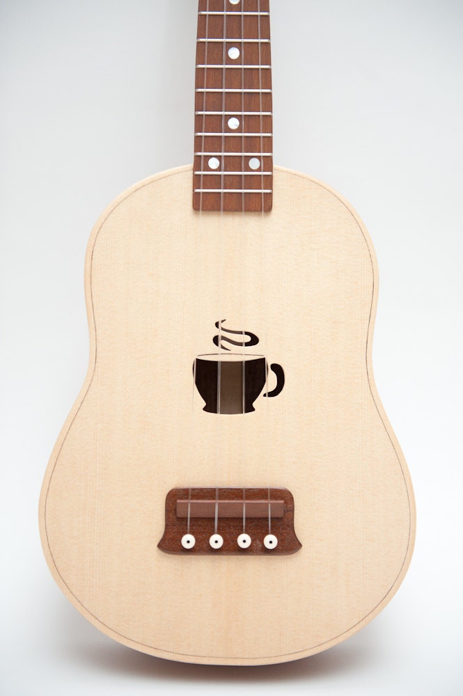 Ukulele (customizable sound hole of choice) Example: coffee cup