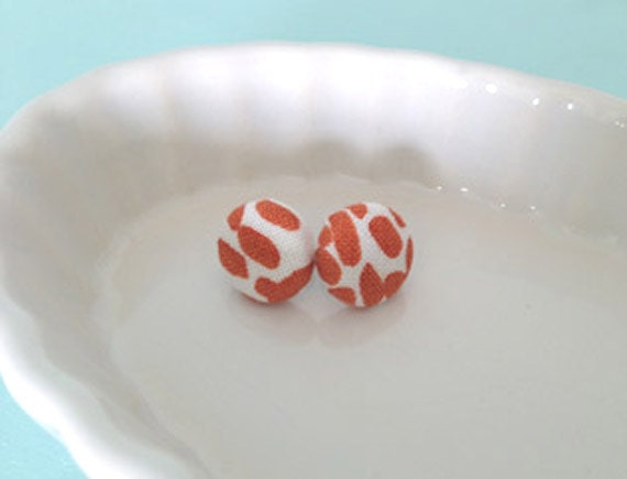 fabric covered button earrings in burnt orange and white