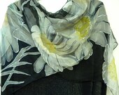 Black silk scarf with white daisies. 100 % of the money goes to support the mission to fight cancer