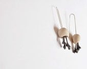 minimalistic pod earrings with grey hearts
