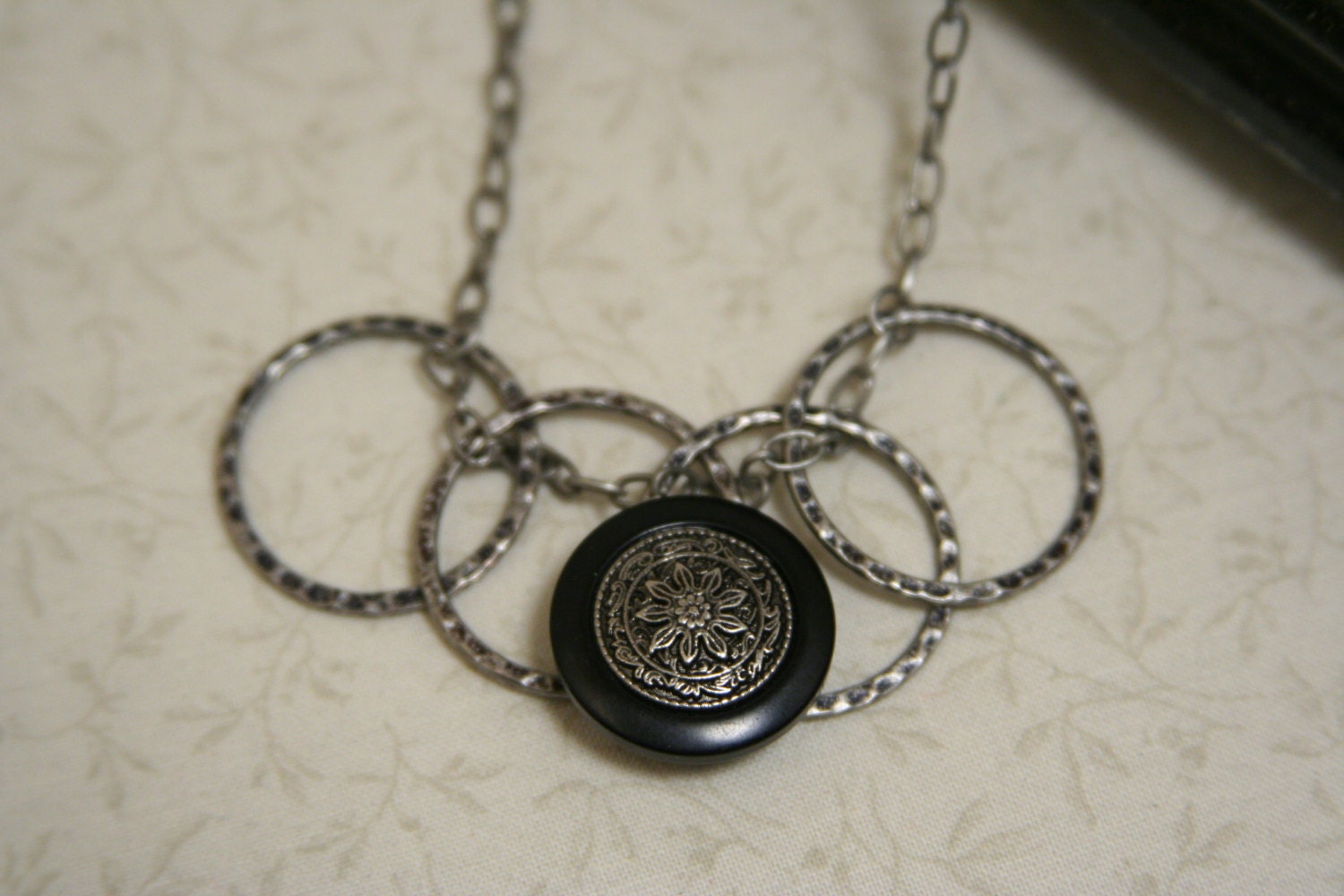 Geometric Necklace - pewter circle hoops intertwined with pewter chain and a button