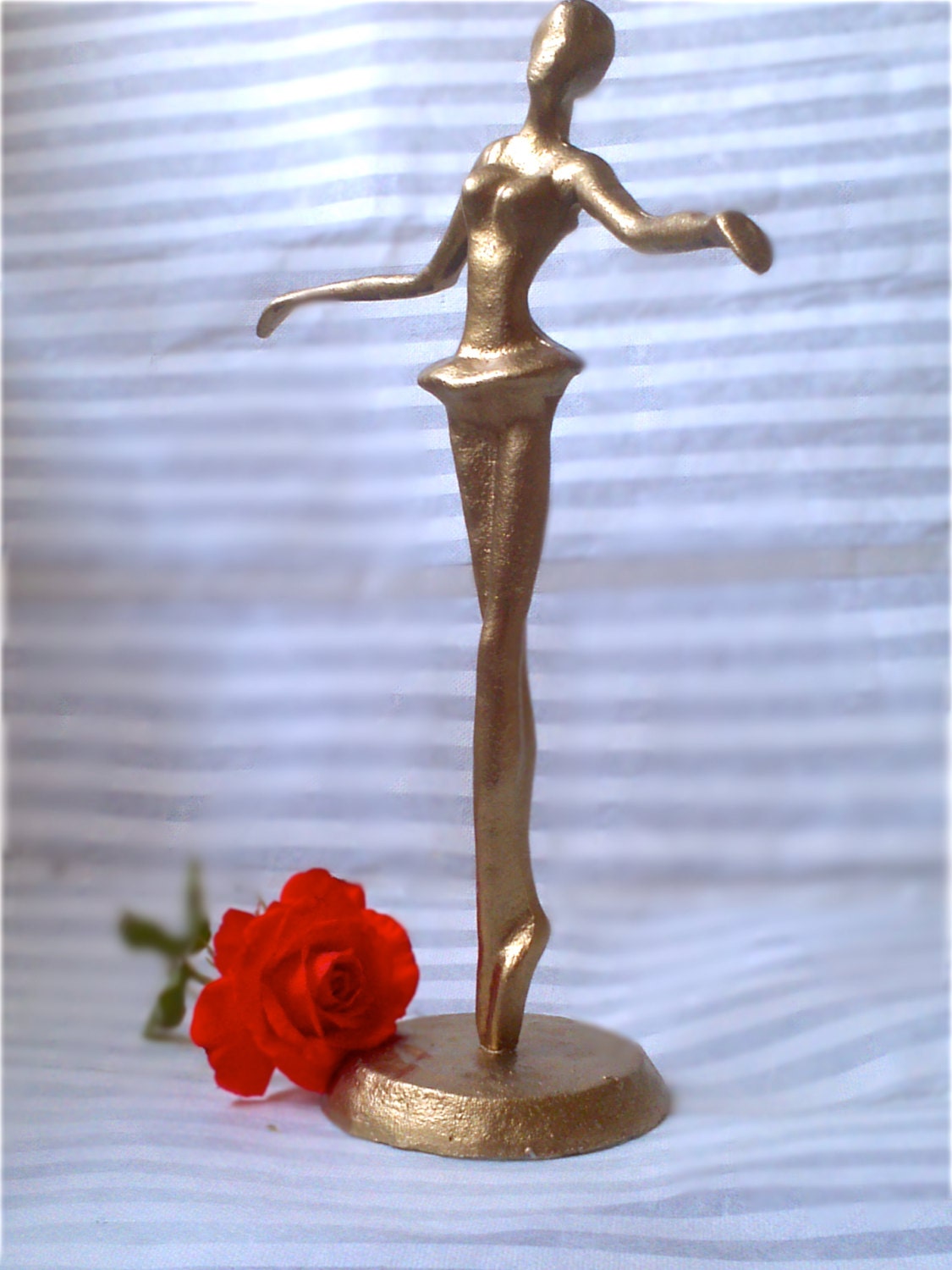 dancing ballerina. gold.