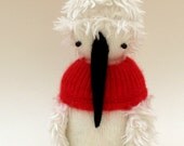 Baby Penguin - Handmade plush sculpture - white woollen body with furry wings - wearing red jacket and furry hat.
