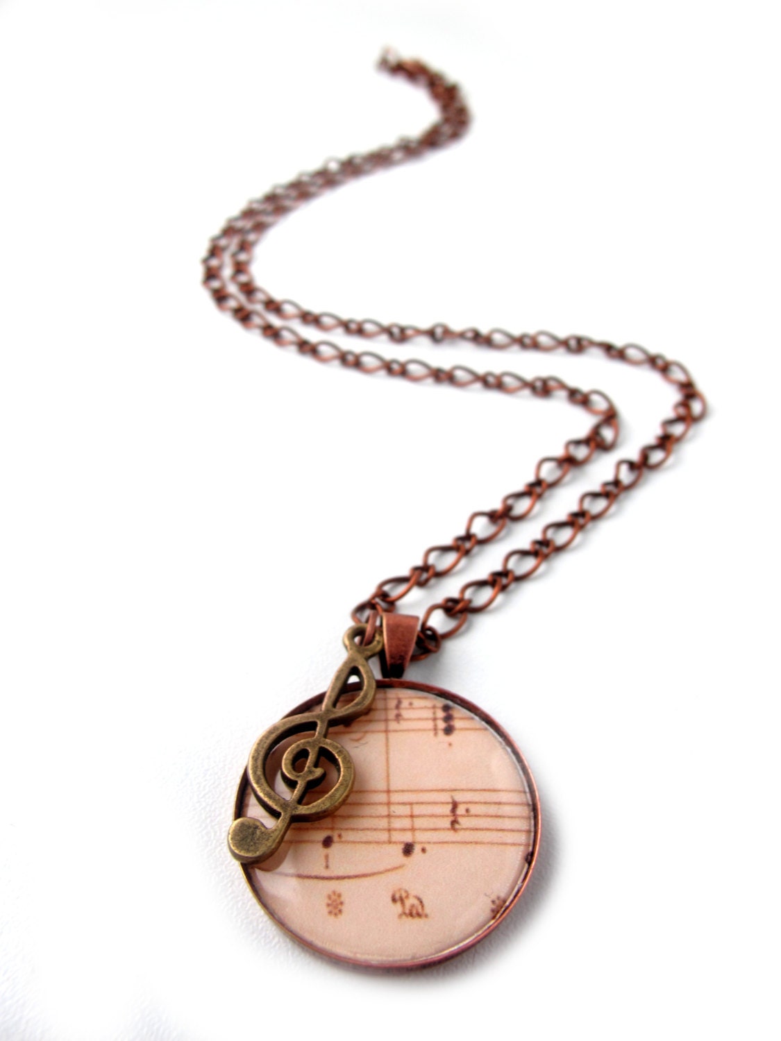Music necklace, antiqued bronze music necklace with sheet music and treble clef charm.