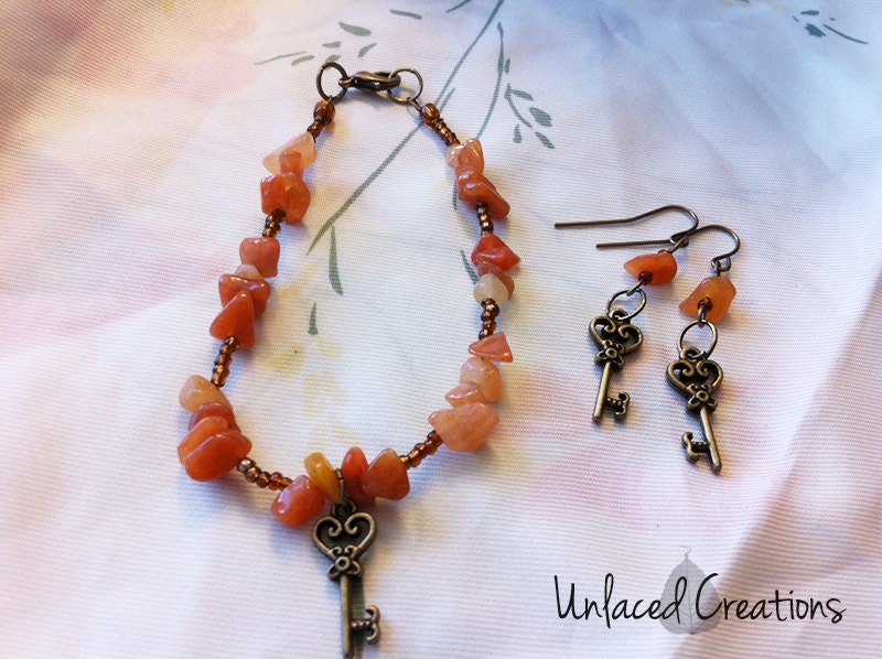 nadia. a red aventurine & brass key bracelet and earring set.