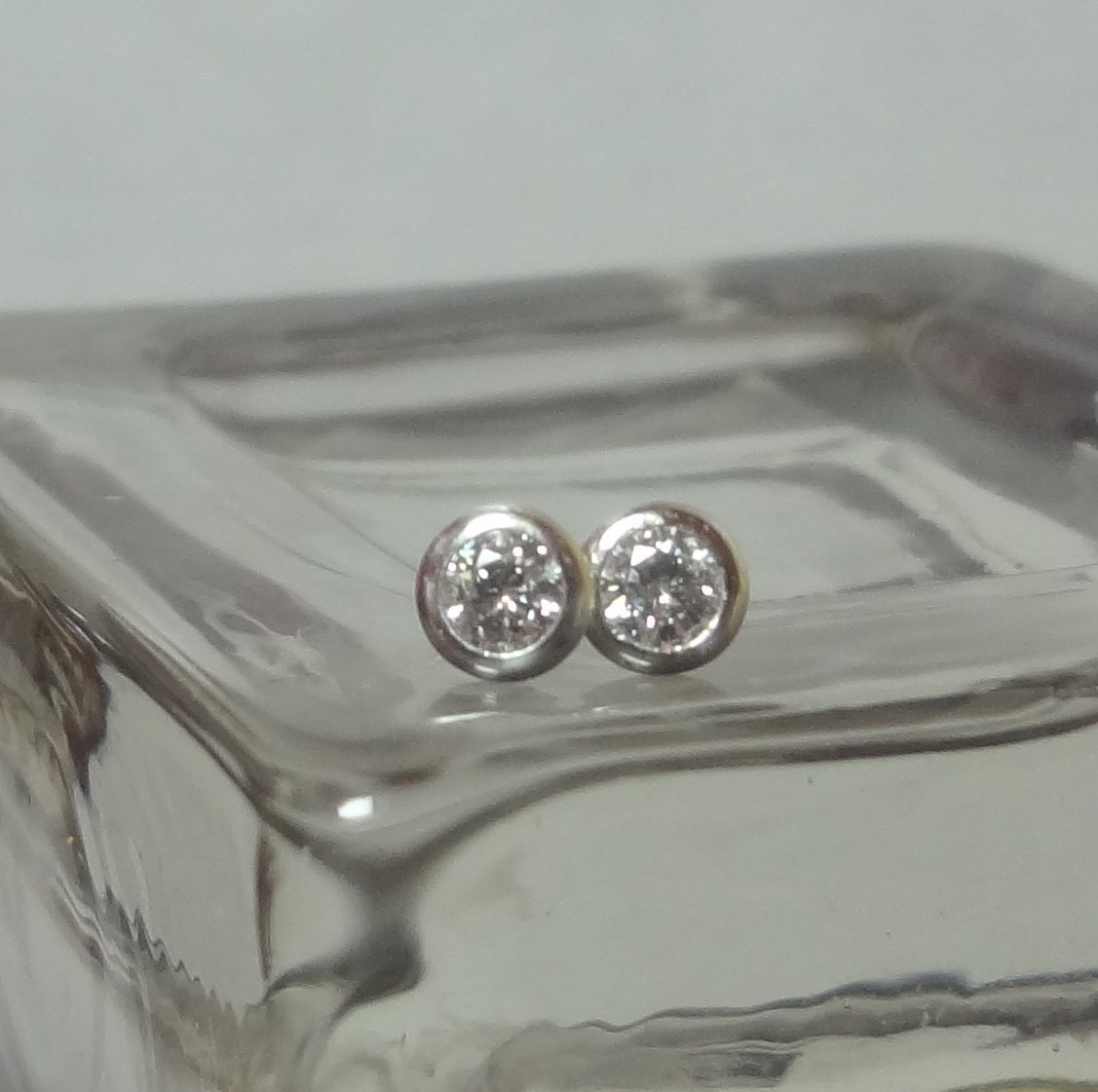 3mm Moissanites in Sterling Silver Round Bezel Stud Setting