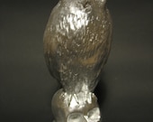 Handmade owl on skull sculptures