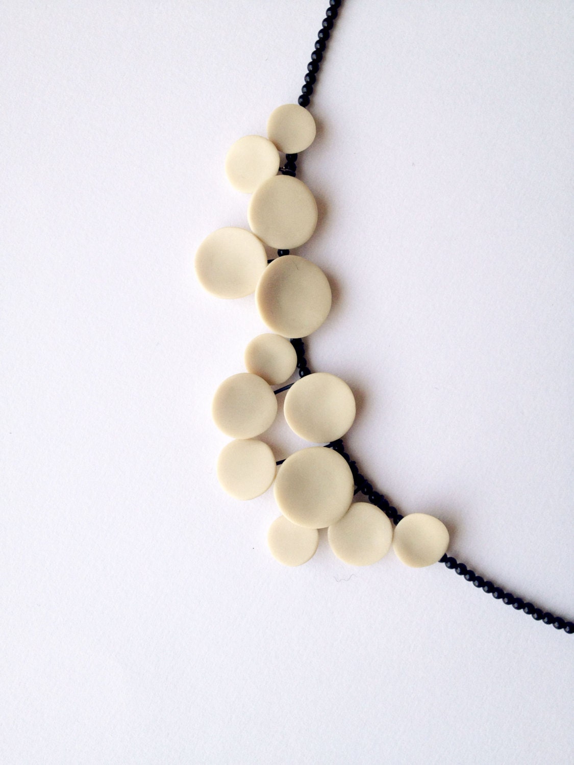 geometrical contemporary handsculpted polymer clay necklace. nO 205 ''dots between black onyx''