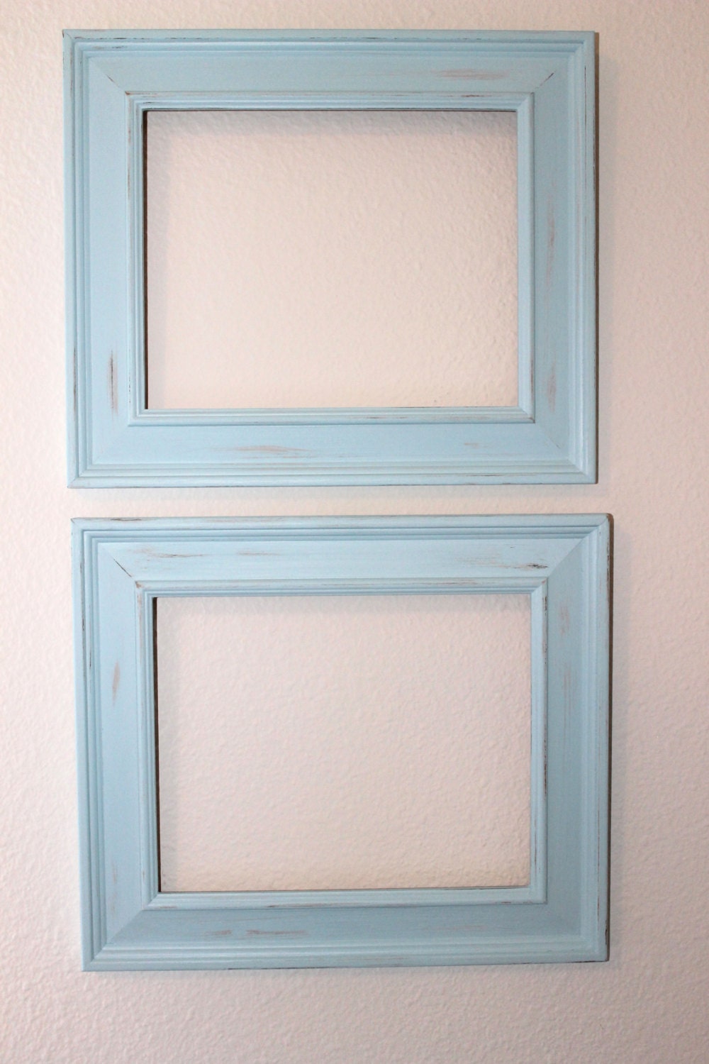 A set of blue distressed 8X10 picture frames by Bitstocherish
